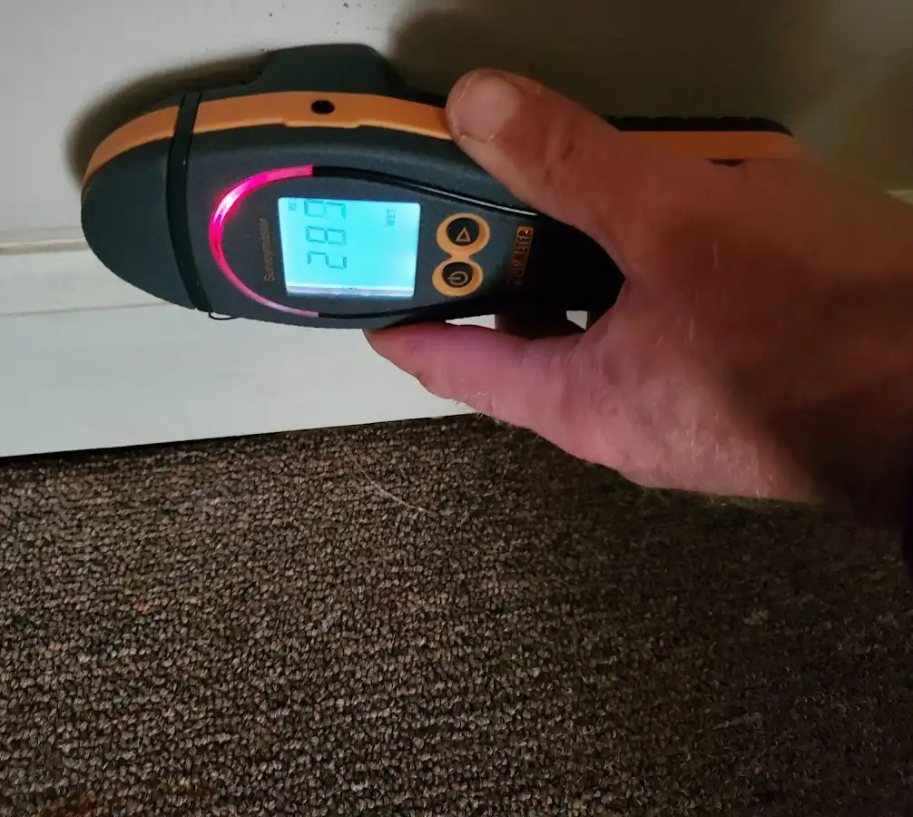 Moisture detection at baseboard during Storm Damage Restoration in Sachse